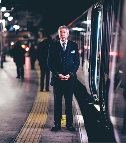 Caledonian Sleeper host on platform 