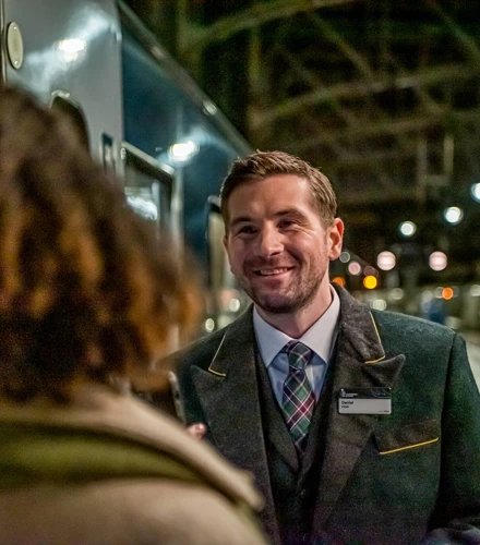 Caledonian Sleeper host on platform