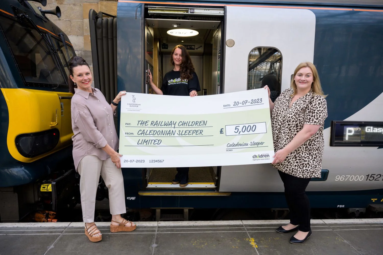 Kathryn Darbandi presenting cheque to The Railway Children