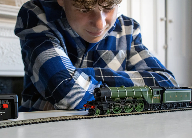Man looking at his model of the Flying Scotsman