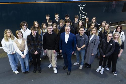 Millburn Academy Students standing next to Caledonian Sleeper at London Euston