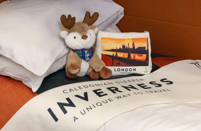 Caledonian Sleeper stag plushie with branded wash bag and blanket.