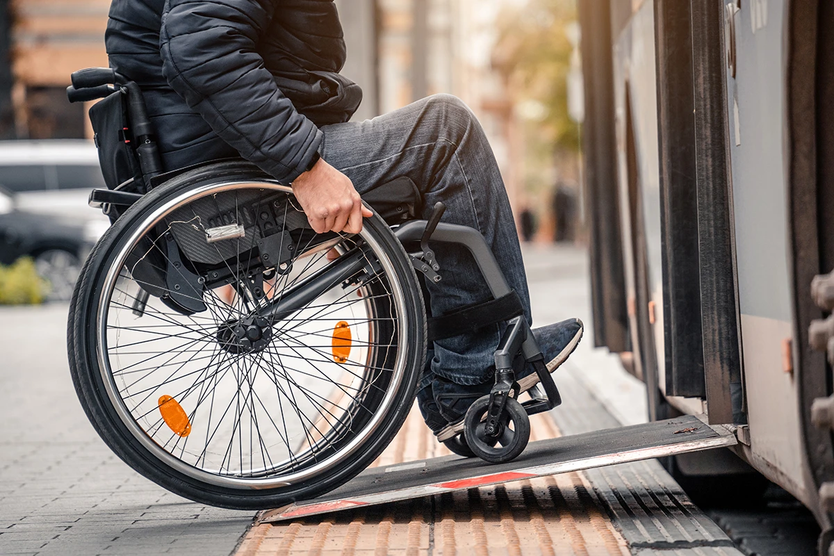 Wheelchair user boarding train